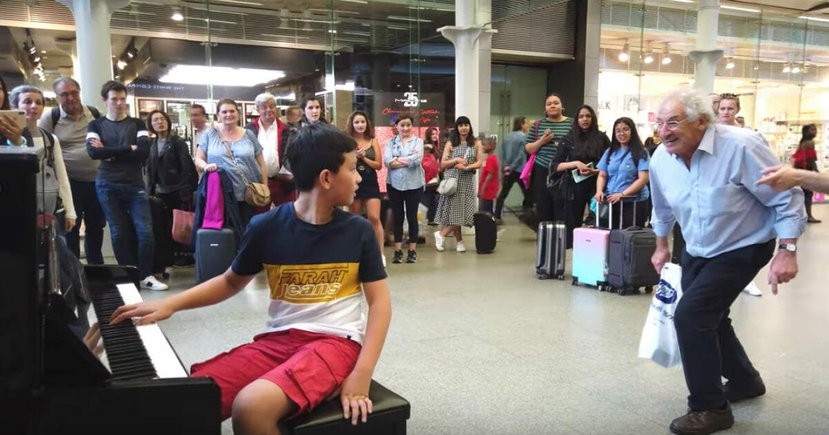 Two shoppers interrupt young boy on piano to request he play 'Bohemian Rhapsody'
