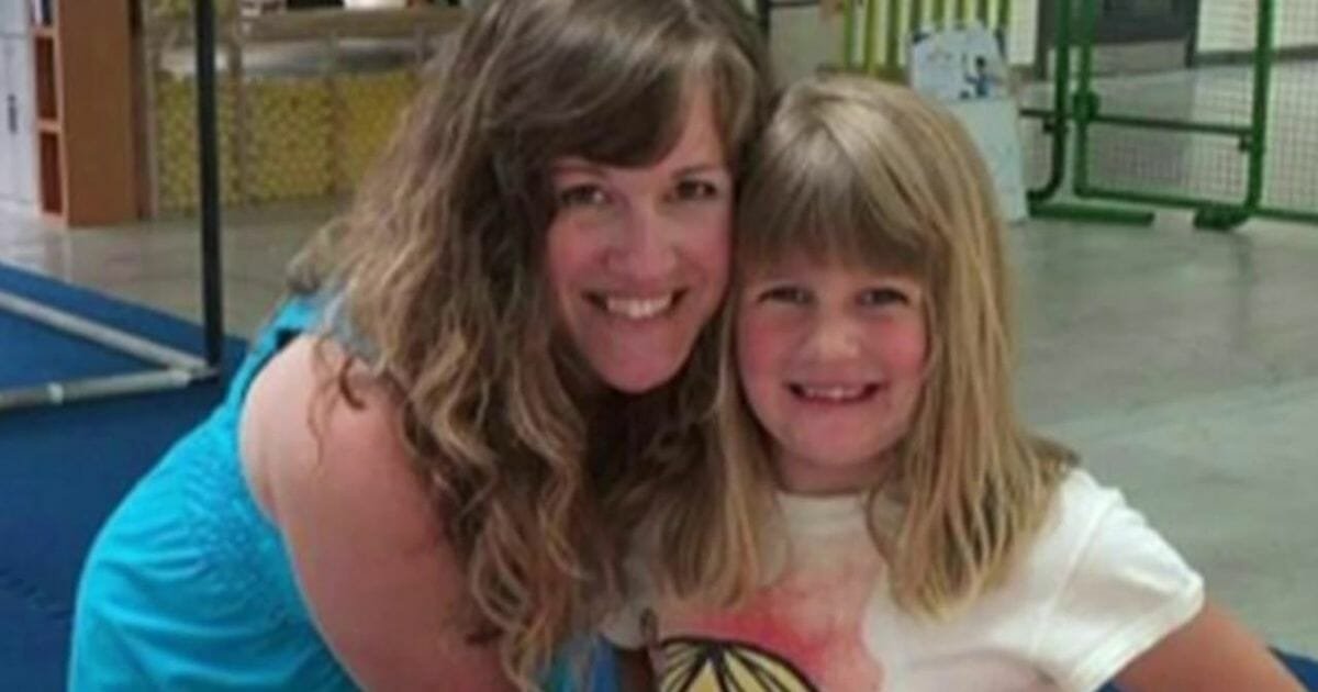 Mom found cradling dead daughter, 8, in car trunk after killing her to spite ex-husband