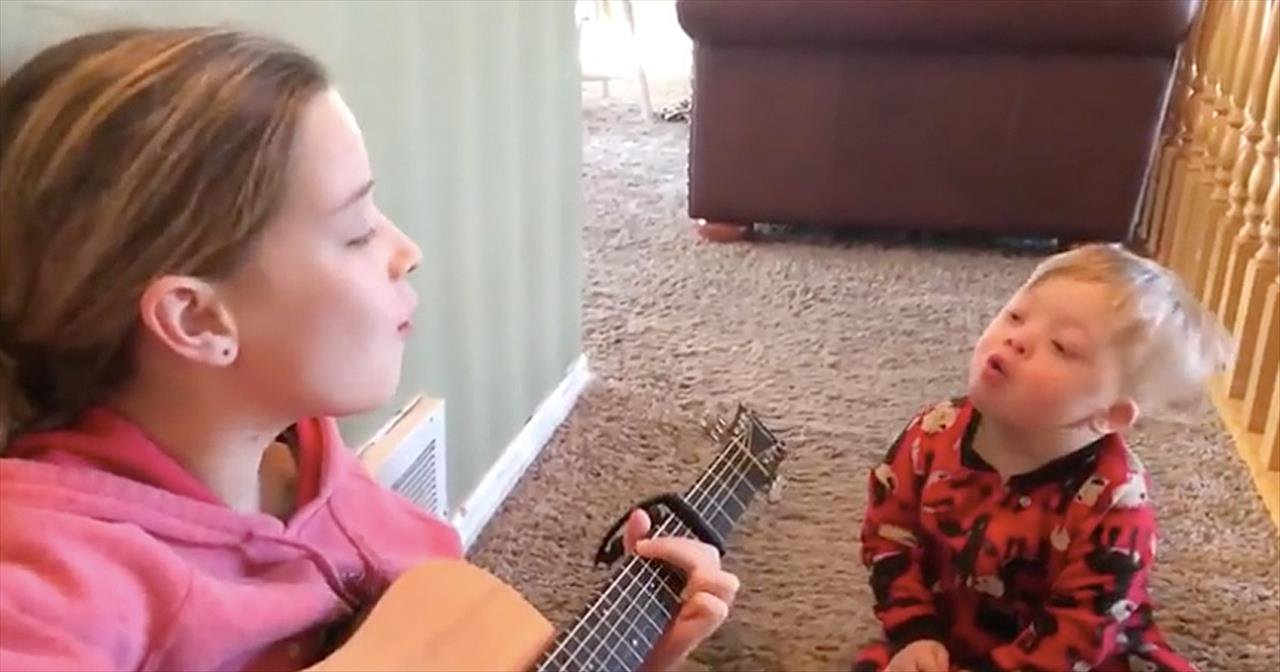 Big sister sings "You Are My Sunshine" for little brother who has Down syndrome